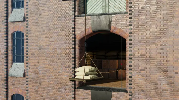 Sacks being hoisted into a warehouse loading door